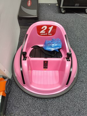 Lot 121 - Pink ride on kids toy with charger