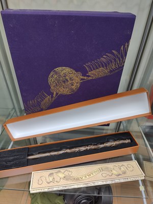Lot 97 - Harry potter wand and harry potter deluxe illustrated edition of philosophers stone