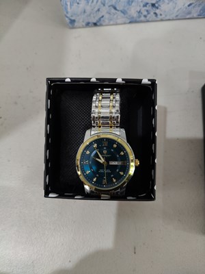 Lot 121 - Poedagar watch silver/ gold w/ blue face