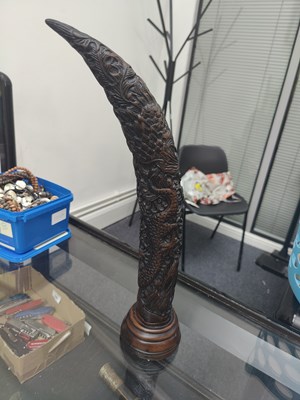 Lot 131 - Carved horn with buffalo leather