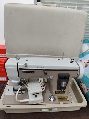 Lot 142 - Two Newhome sewing machines withcase