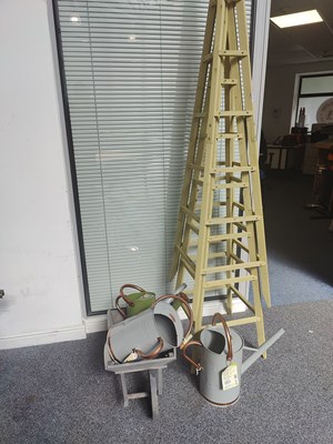 Lot 181 - Climbing garden frame, Wheelbarrow & Watering Cans