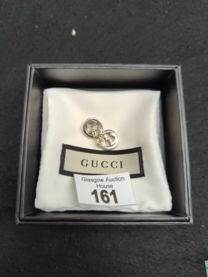 Lot 161 - Two earrings bearing Gucci logo