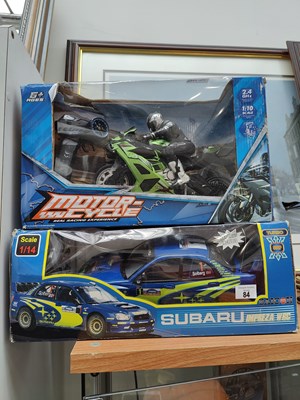 Lot 84 - R/C motorcycle and Subaru toy in box
