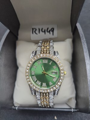 Lot 131 - Silver gold and green bling gents watch in box