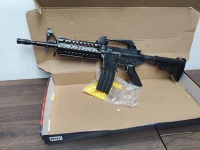 Lot  67 - M4 Style BB Gun With Ammo