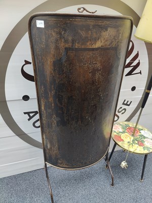 Lot 119 - Large metal fire screen in shield style