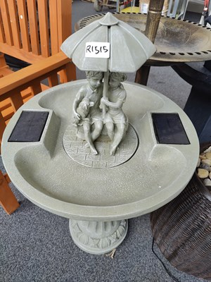 Lot 216 - Solar power water fountain featuring 2 children under umbrella