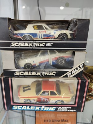 Lot 106 - 3 retro scalextric collectable model race cars in display boxes