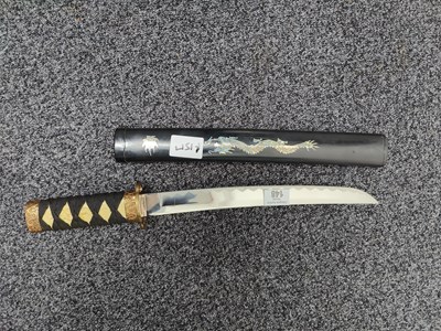 Lot 148 - Short samurai sword bearing dragon logo on sheath