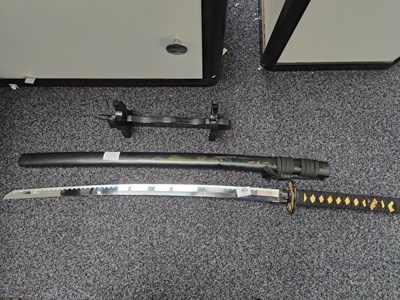 Lot 159 - Black sheath samurai sword with painted dragon Inc stand
