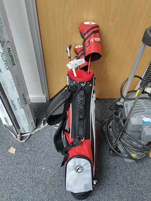 Lot 194 - Junior set of golf clubs in bag with stand