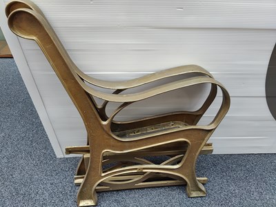 Lot 107 - Pair of bench ends in gold finish