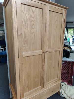 Lot 258 - Oak finish wardrobe with single drawer