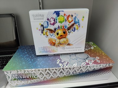 Lot 79 - Pokémon prismatic evolutions Pokémon centre box and spc set with etb opened