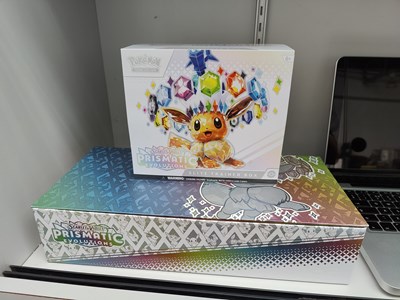 Lot 81 - Pokémon prismatic evolutions Pokémon centre box and spc set with etb opened