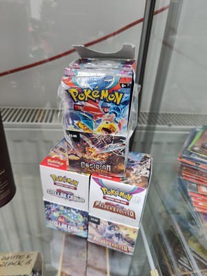 Lot 103 - Pokémon collection of boosters in paldea evolved, steller crown and obsidian flames opened
