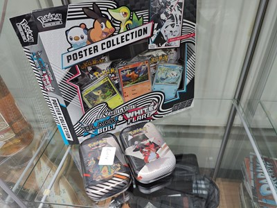 Lot 111 - Pokémon poster collection including booster tins opened