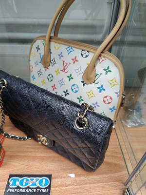 Lot 121 - 2 handbags bearing various logos