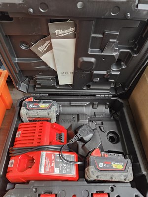 Lot 6 - Milwaukee cause With Charger and 2 batteries