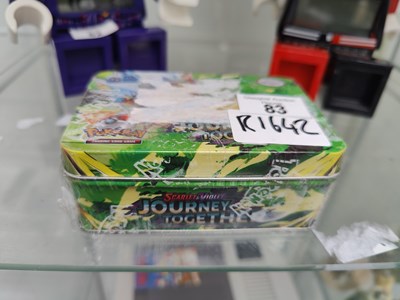 Lot 83 - Pokemon scarlet/violet journey together tin in authentic wrap