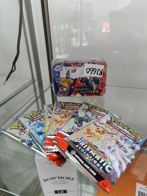 Lot 111 - Pokemon journey together tin with additional packs which may not be authentic