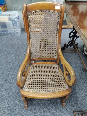 Lot 130 - Antique small rocking chair with woven seat and back