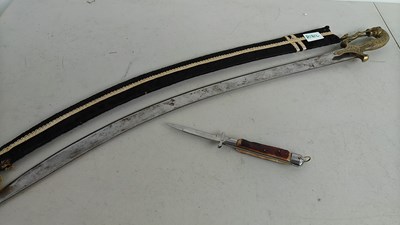 Lot 153 - One Flick Knife With Horn Handle & Ornate Handle Saber With Fabric Sheath