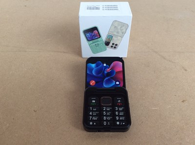 Lot 181 - Small flip phone in box