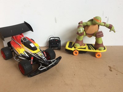 Lot 54 - Red car and ninja turtle toy untested