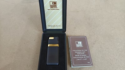 Lot 142 - Vintage win international lighter