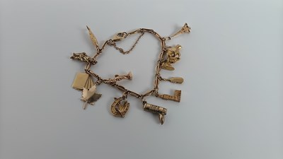 Lot 33 - 9ct Gold charm bracelet 20.11gram, est £550-£600