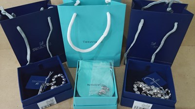 Lot 150 - Bracelet, necklace and earrings bearing Tiffany and Swarovski logos