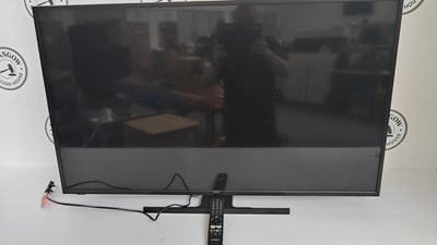 Lot 26 - Hitachi large smart TV with remote tested working