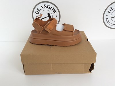 Lot 79 - A Pair Of Sandals Bearing The Logo UGG