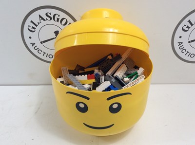 Lot 14 - Yellow Lego head with Lego inside