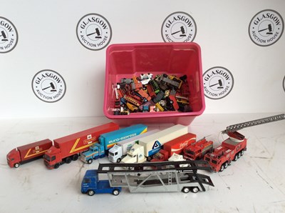 Lot 16 - Pink box with cars and trucks etc