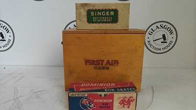 Lot 77 - Vintage first aid box, dominion bob skates and singer buttonhole attachment