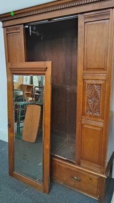 Lot 247 - Large hand carved wardrobe with internal traditional fittings