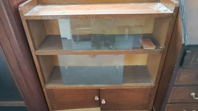Lot 193 - Small glass front library book case with cupboard on bottom