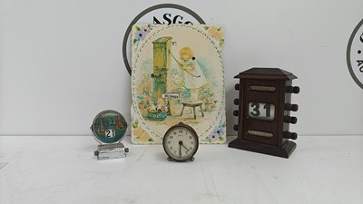 Lot 96 - 3 perpetual calenders and a small travel clock