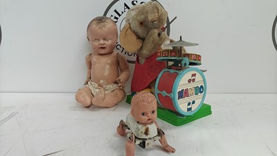 Lot 87 - Mambo battery operated elephant, wind up crawling baby and baby doll all collectable