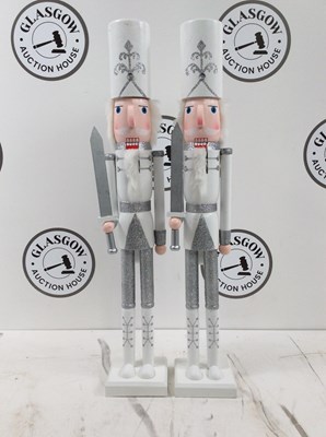 Lot 25 - A Pair Of White Nutcrackers