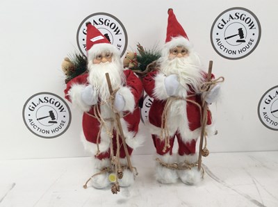 Lot 212 - A Pair Of Santa’s