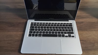 Lot 99 - MacBook pro laptop fully reset with no charger minor damage beside track pad