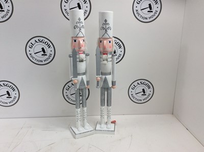 Lot 83 - A Pair Of White & Silver Nutcracker's