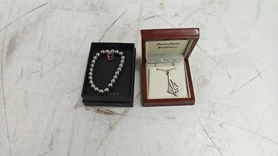 Lot 170 - Silver necklace and a bangle