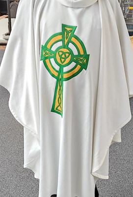 Lot 126 - Church white robe with green and gold cross