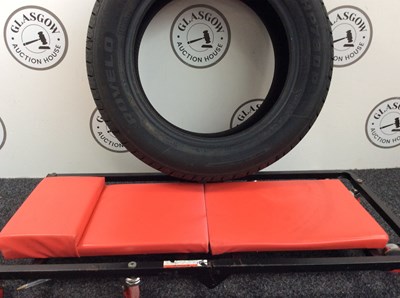 Lot 125 - Tyre and under at bed for fixing car