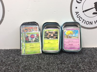 Lot 111 - 3x Pokemon tins with cards in them